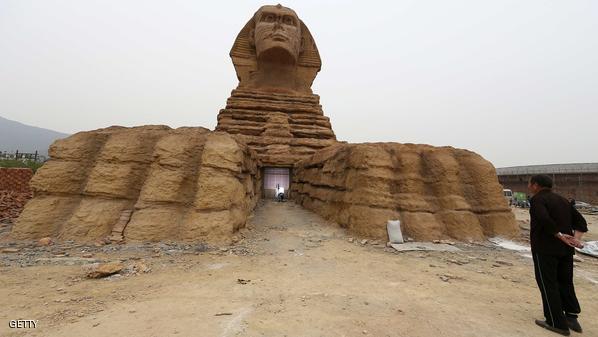 A man looks at a full-scale replica of the Sphinx on the outskirts of Shijiazhuang