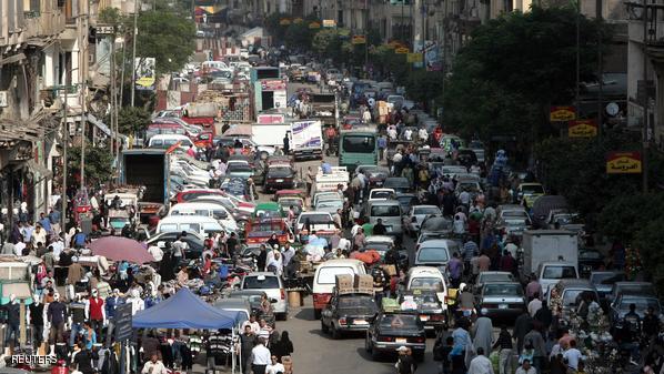 Egyptians crowd a popular market in Cair