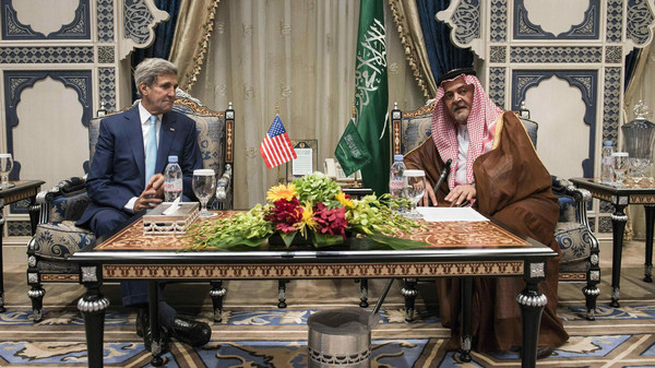 U.S. Secretary of State Kerry meets with Saudi Arabia's Foreign Minister Prince Faisal at King Abdulaziz International Airport in Jeddah
