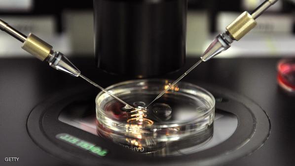 A medical worker works on a dish ready f