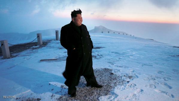 North Korean leader Kim Jong Un views the dawn from the summit of Mt Paektu