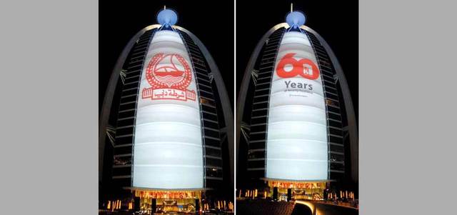 برج خليفة وبرج العرب يتزيّنان بشعار «شرطة دبي»